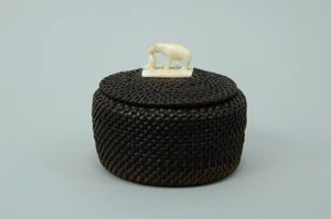 Image: baleen basket with bear finial and heart-shaped starter disk